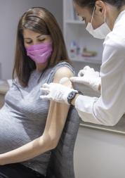 Pregnant woman getting a vaccine