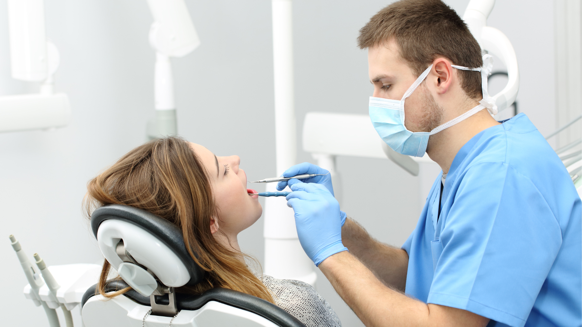 Dentist looking at patient's mouth