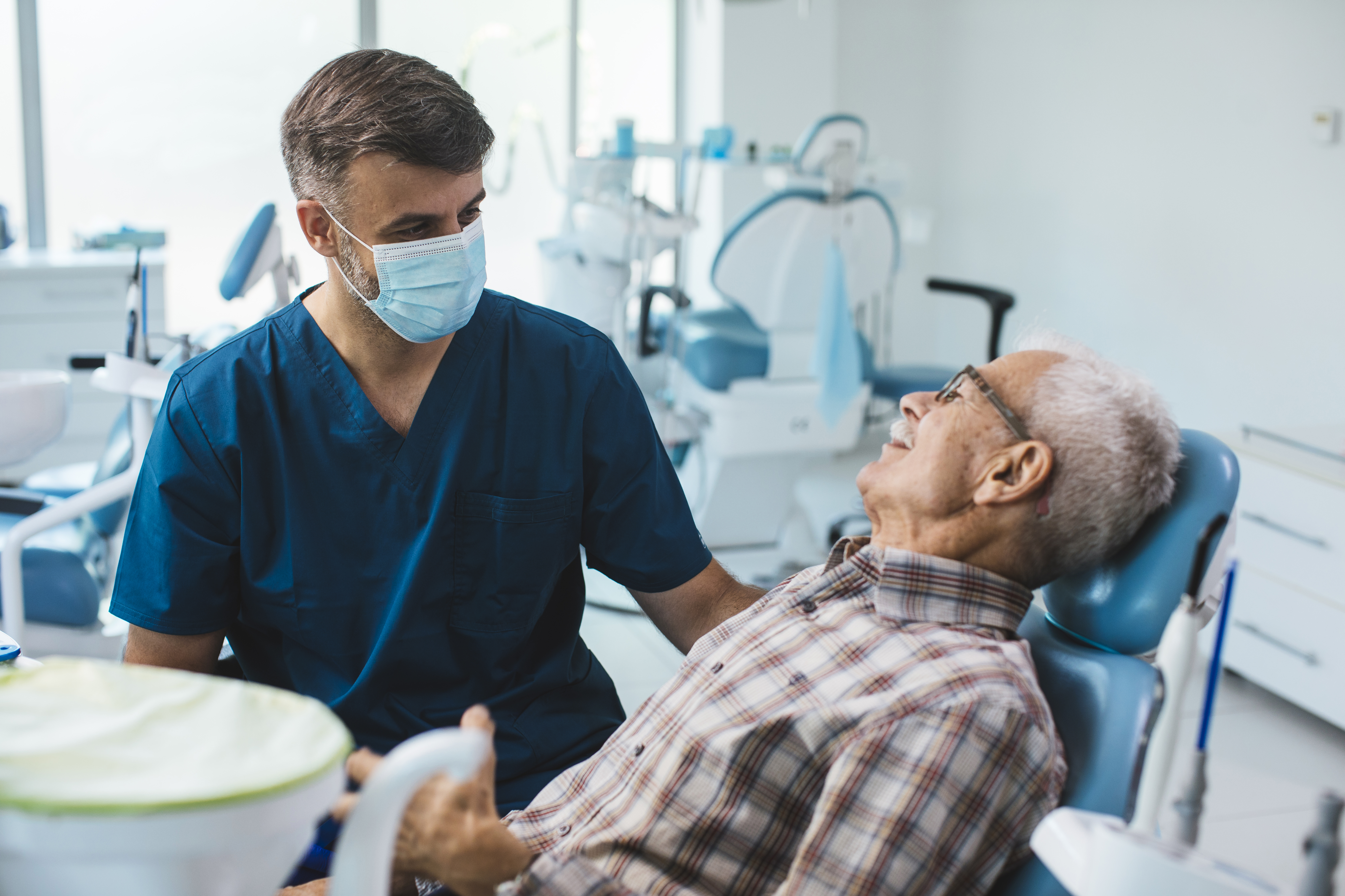 Senior patient sitting in his dentists chair before starting his checkup