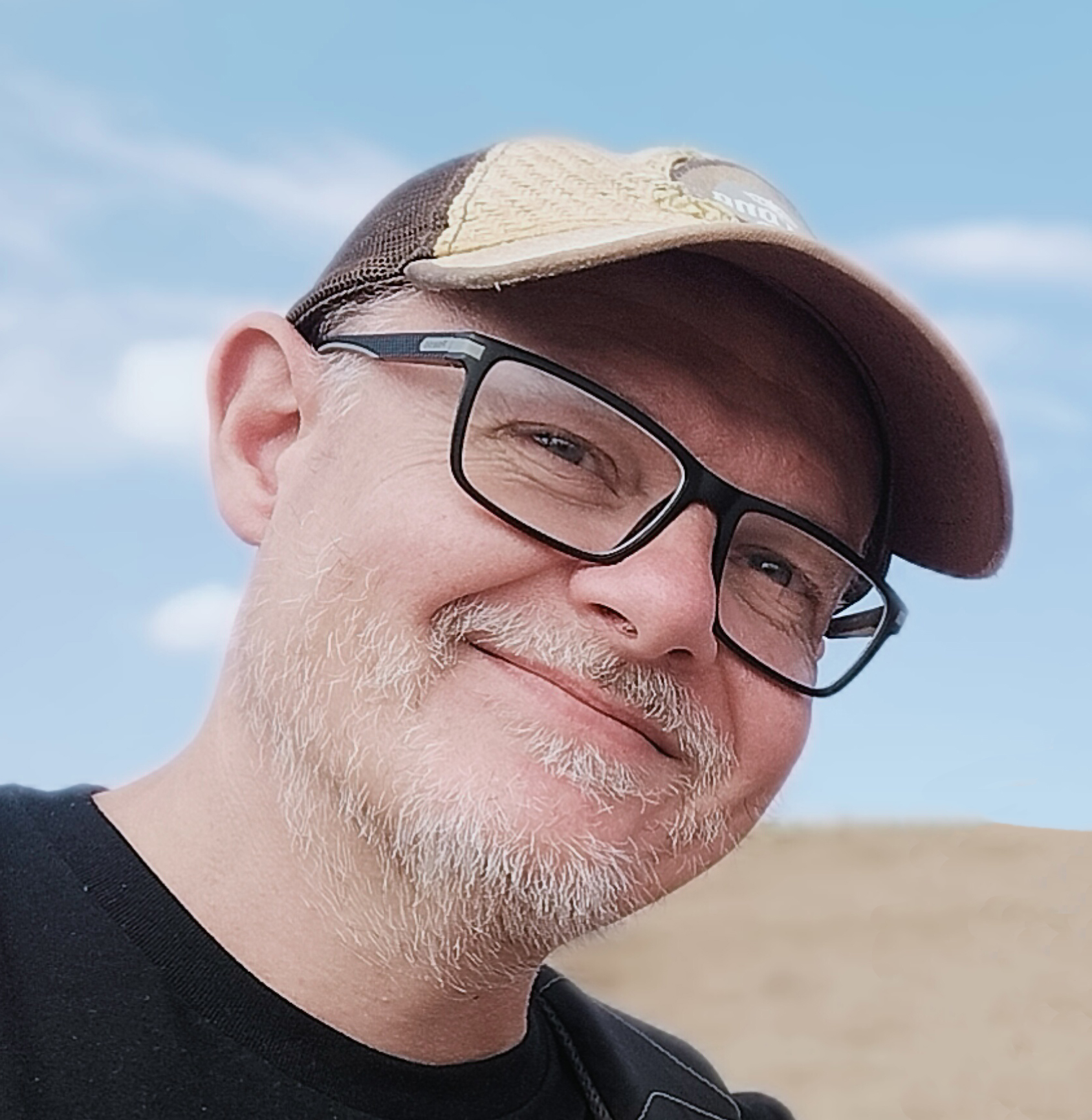 Rob, a white man wearing glasses