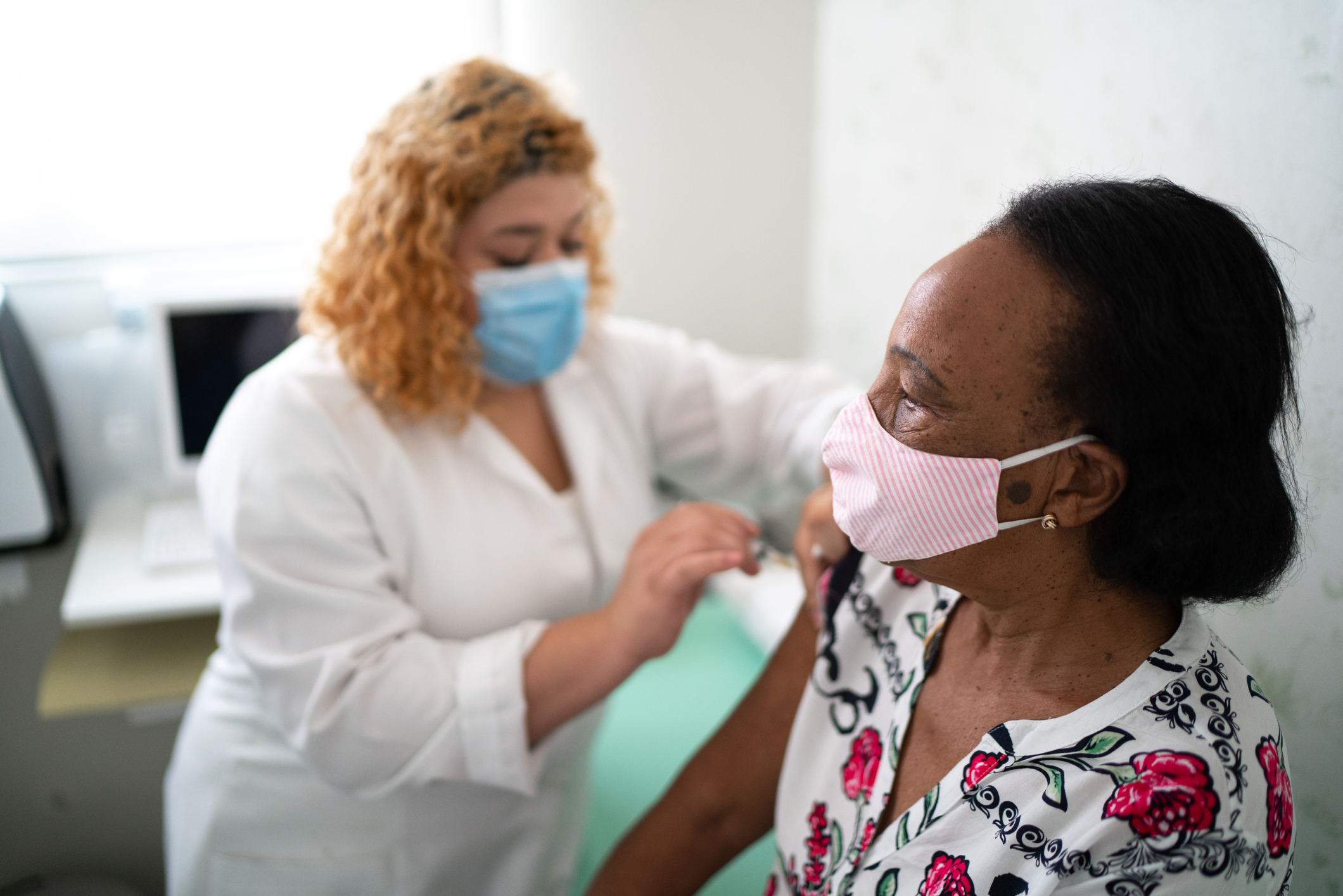 A woman getting vaccinated