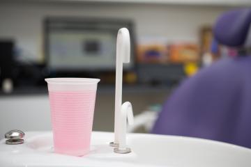 A cup of fluid in a dentist's office