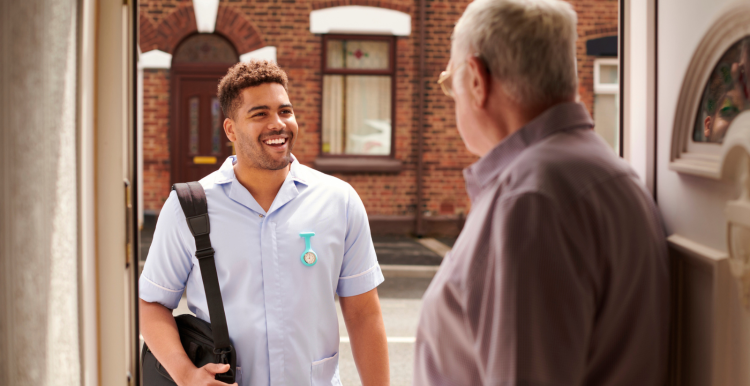Social care worker with elderly man
