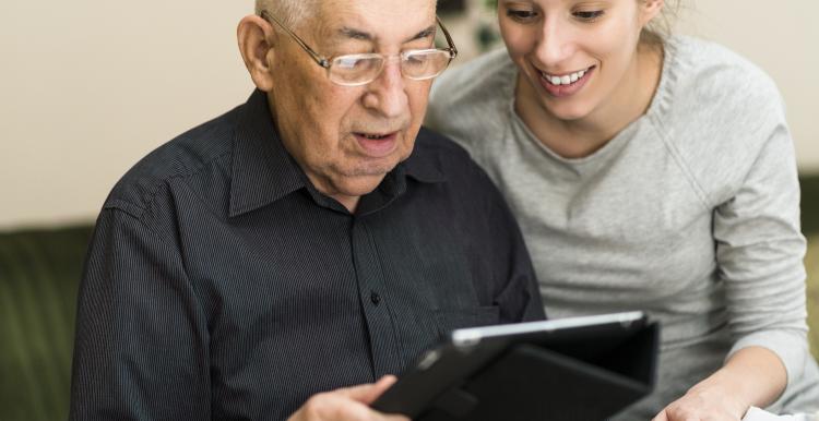 Man and woman using a tablet