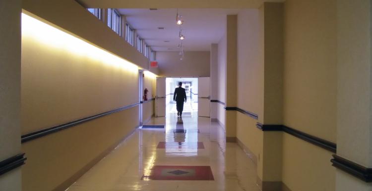 person walking down a corridor