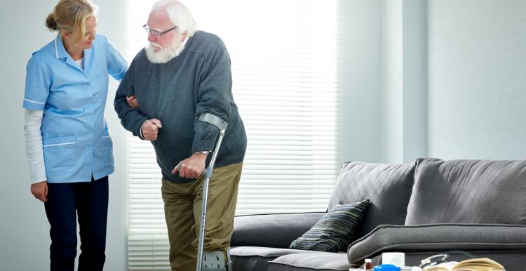 Older man at home with carer