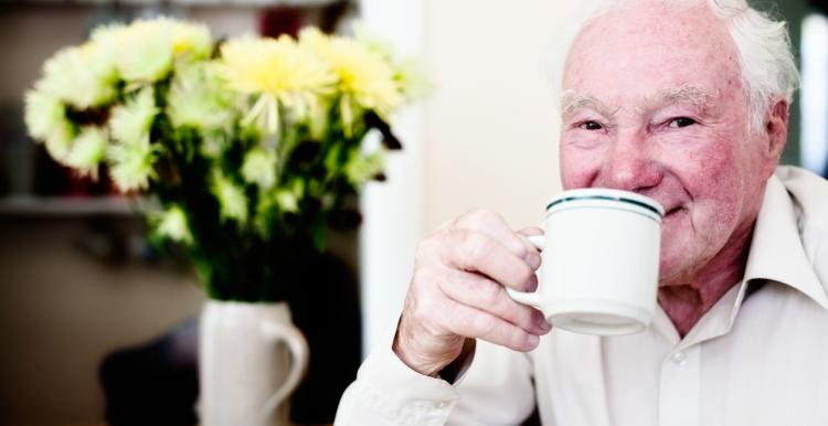 Elderly man drinking a cup of tea