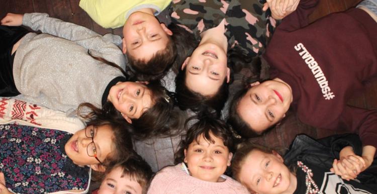 A group of young carers in a circle