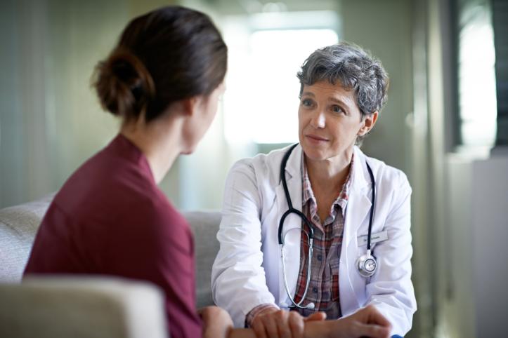 woman talking to doctor