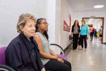 Two women waiting at a hospital