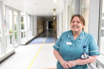 A woman medic smiling at the camera