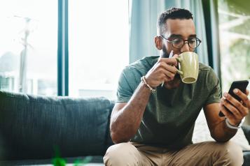 Man drinks a cup of coffee