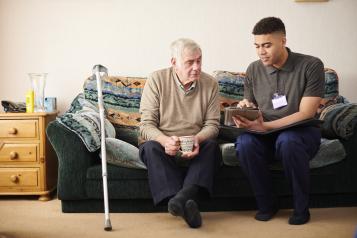 Man at home with carer