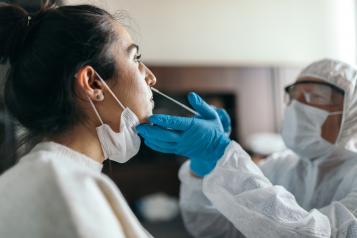 A woman having a lateral flow Covid test A woman having a lateral flow Covid test