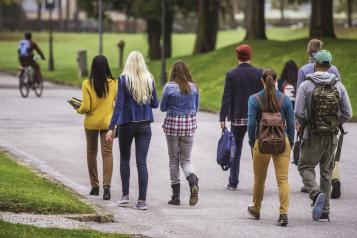 Picture of teenagers walking in a park