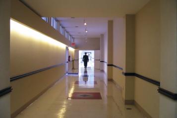 person walking down a corridor