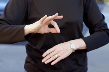 lady communicating in British sign language
