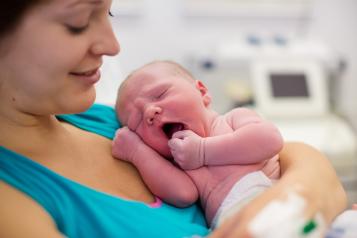 women holding newborn