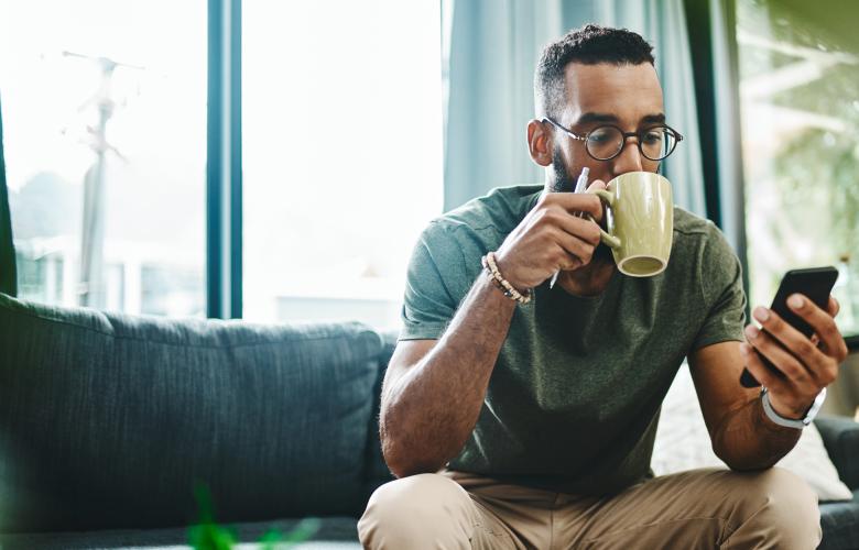 Man drinks a cup of coffee