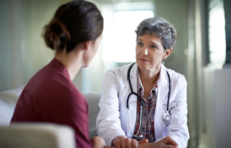 woman talking to doctor